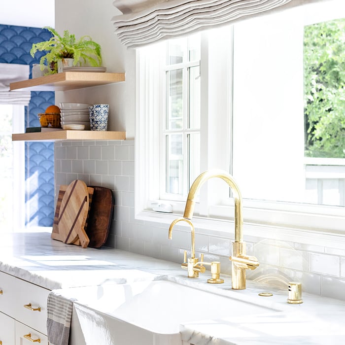 Kitchen remodel details with a gold faucet.