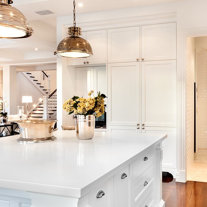 Kitchen remodel with white cabinets and gold details